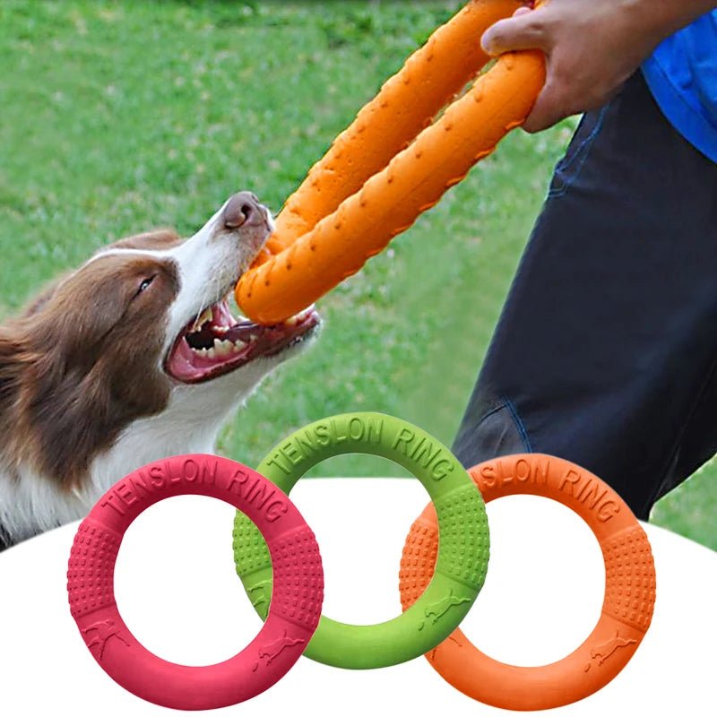 Red dog chew ring toy being held by a hand, showcasing its lightweight EVA material for fetching.
