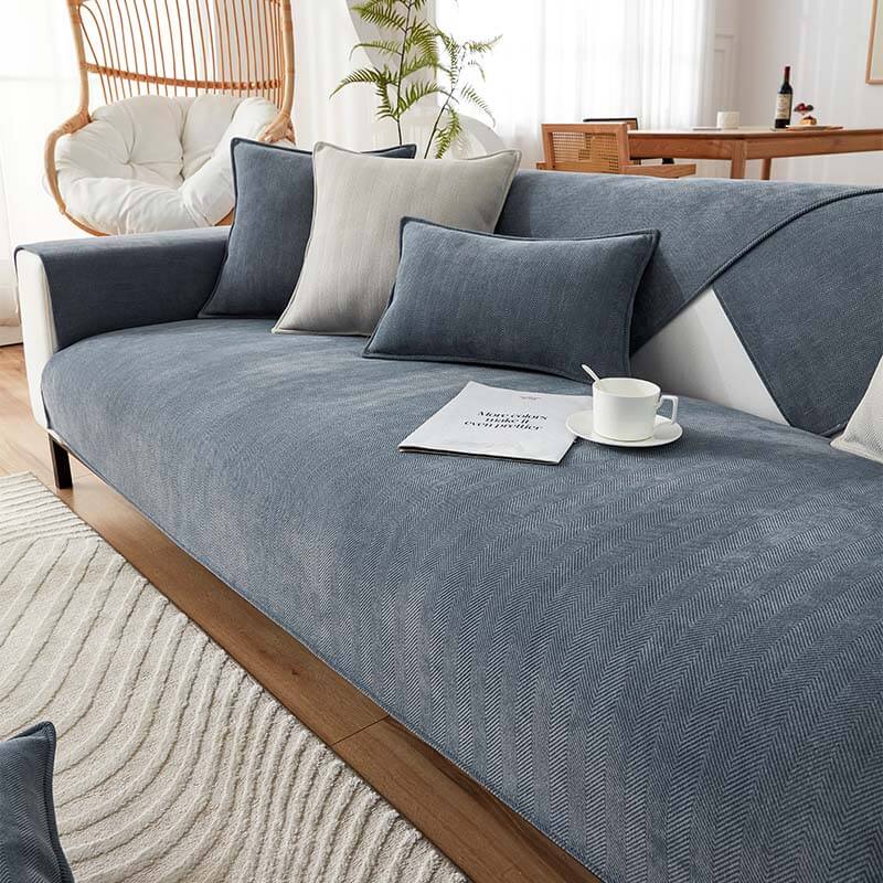 Angled shot of a modern sofa featuring a linen handwoven anti-scratch couch cover