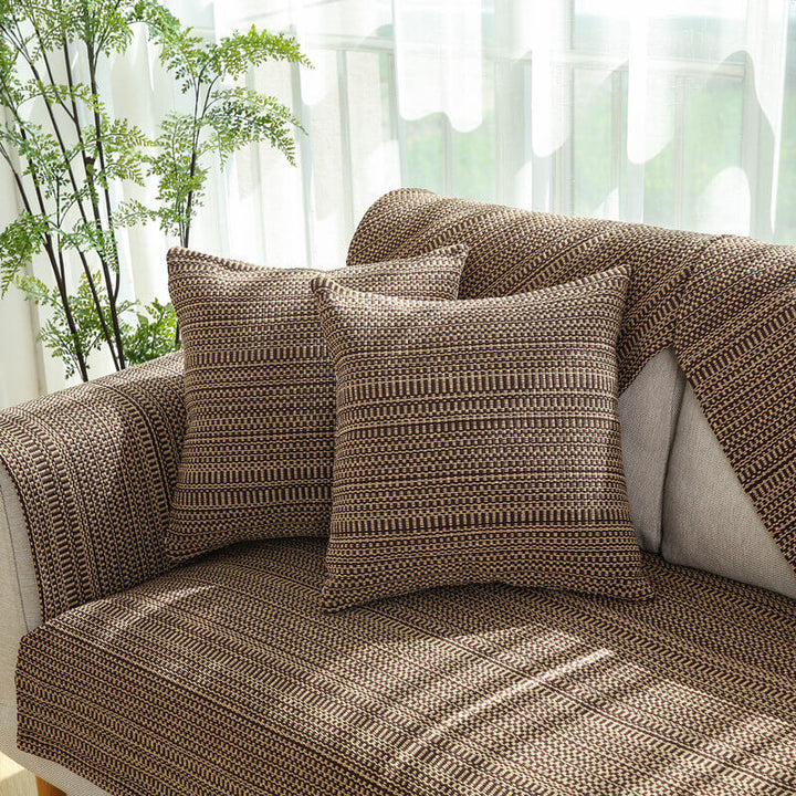 Detail shot of the corner of a sofa protected by a durable linen anti-scratch cover