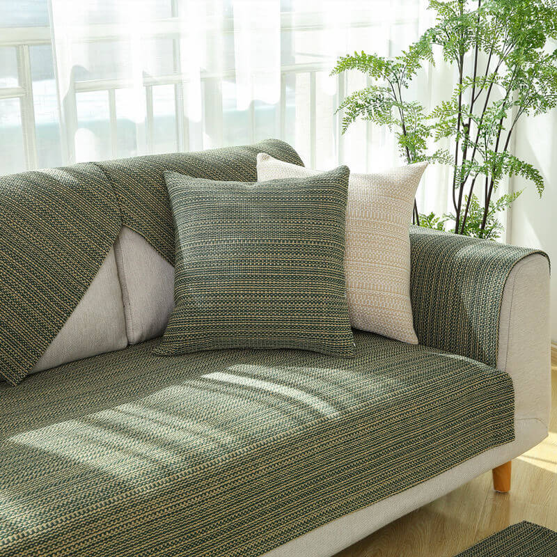 Anti-scratch linen couch cover protecting furniture from pet claws, durable design
