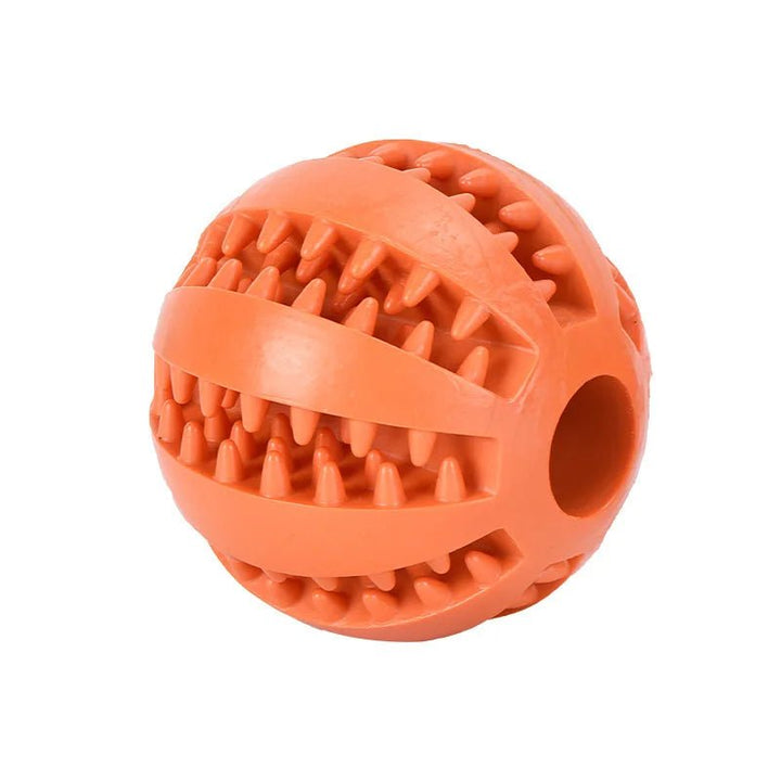 Red durable dog chew ball, a puzzle toy for treat dispensing and canine dental health