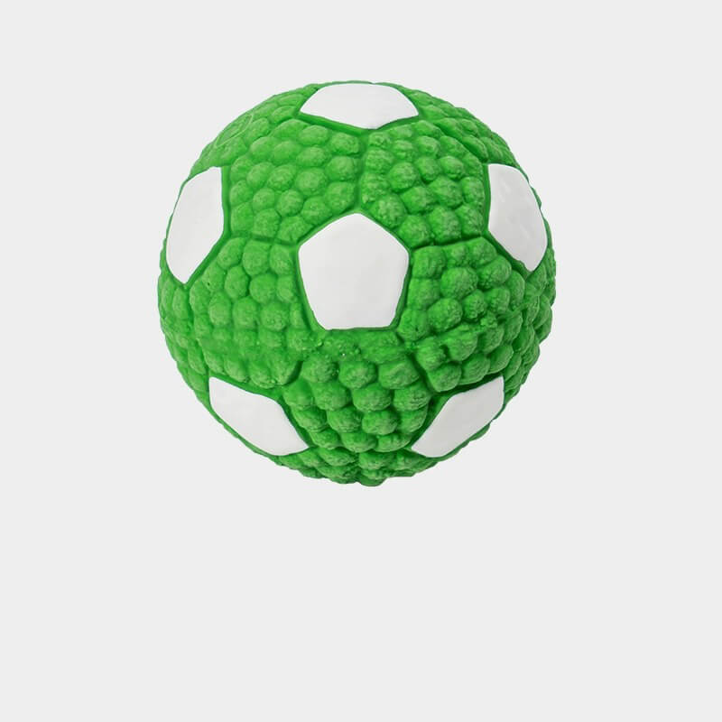 Happy dog playing with a durable pet latex squeaky ball toy, ideal for fetching and chewing