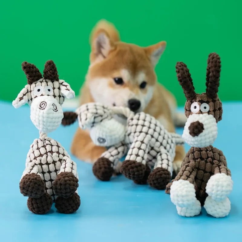 Plush dog toy with squeaker, showing its tough construction for heavy chewers