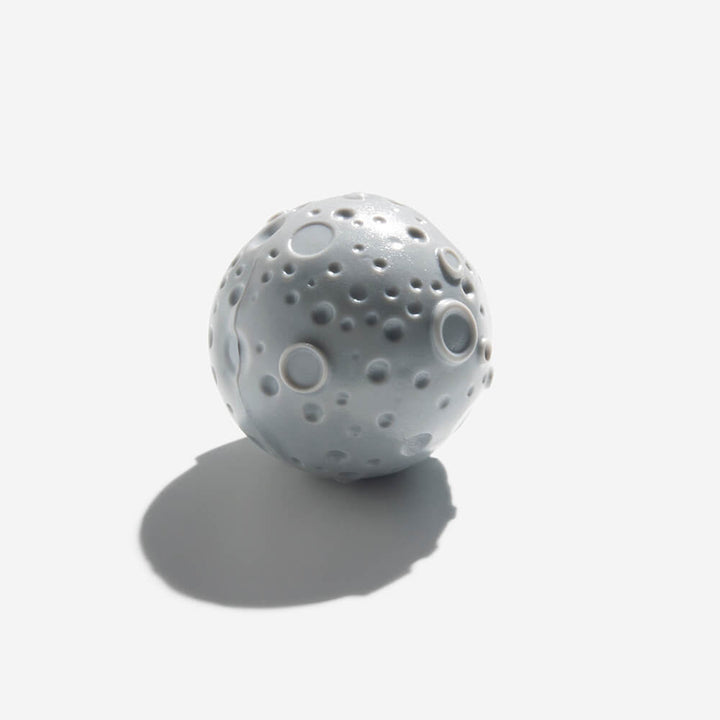 Pet supplies: interactive red treat dispensing ball, durable and bouncy for dogs