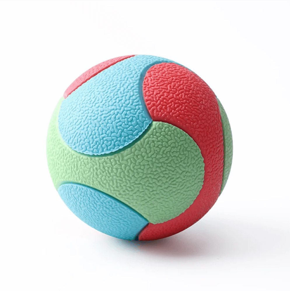 Textured surface of a durable canine ball chew toy, ideal for dog training and teeth cleaning