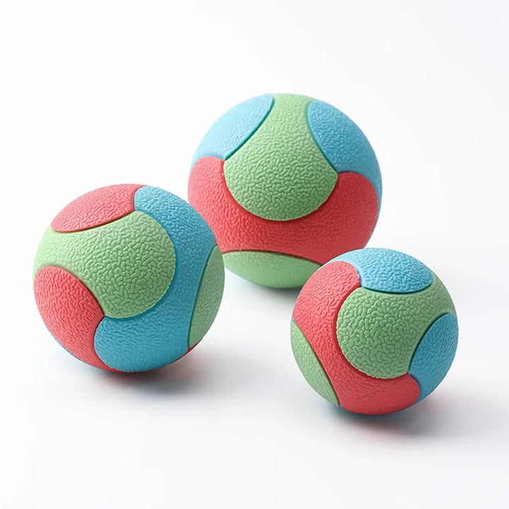 Yellow durable dog chew ball, an interactive pet toy and training aid that cleans teeth during play.