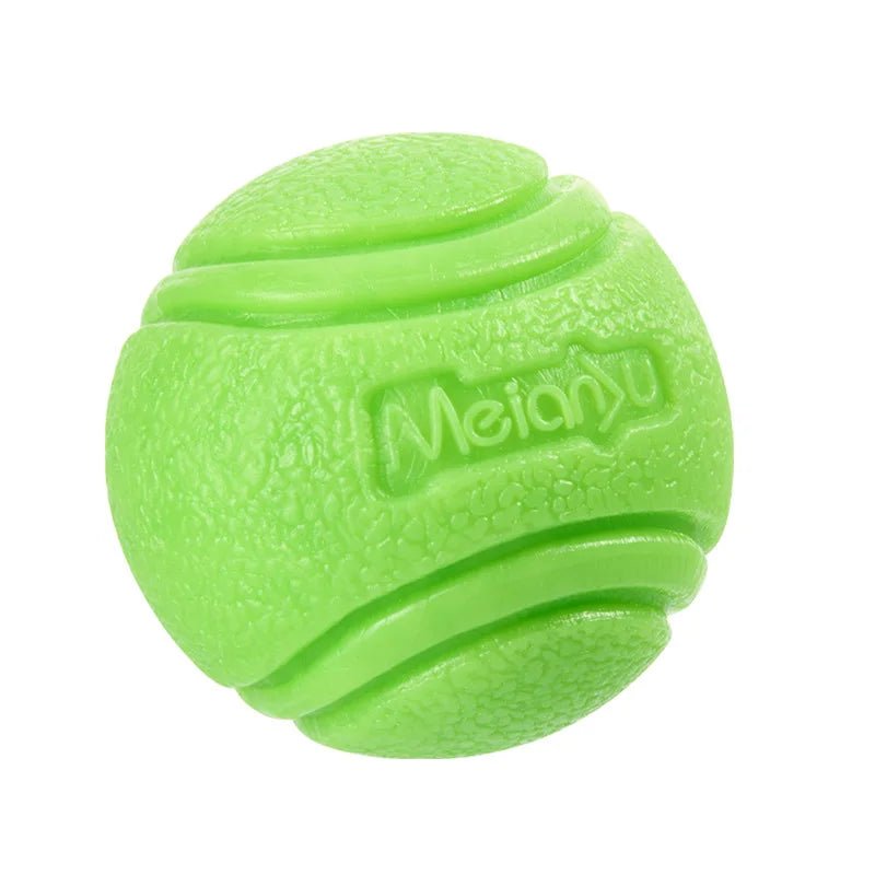 Durable red rubber dog chew ball for dental health, pet supplies, and active dogs, with textured surface.