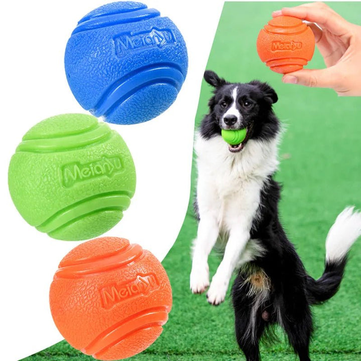 Green rubber dog chew ball, a tough dental toy for dogs, perfect for fetching and promoting healthy gums.