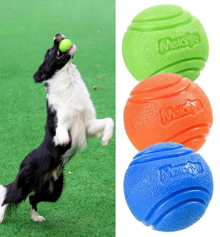 Unisex yellow rubber dog chew ball, multi-textured, designed for dental health and engaging playtime.