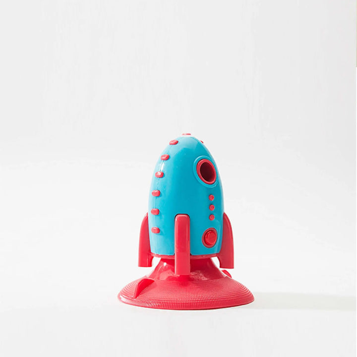 Interactive dog chew toy, rocket design, promoting pet dental health during play.