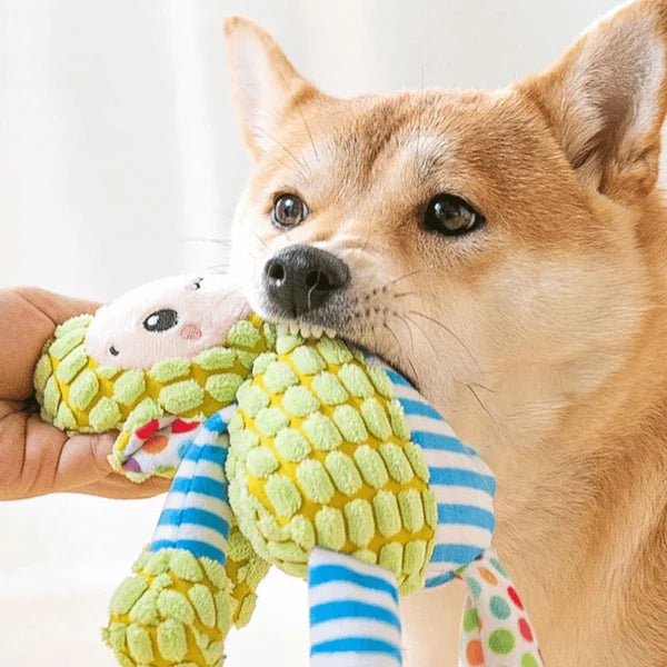 Long-lasting yellow squeaky dog toy, shaped like a banana, for aggressive chewers.