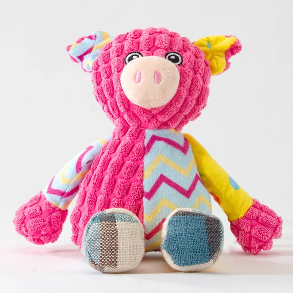 Durable squeaky plush dog toy, shaped like a grey elephant, for aggressive chewers.