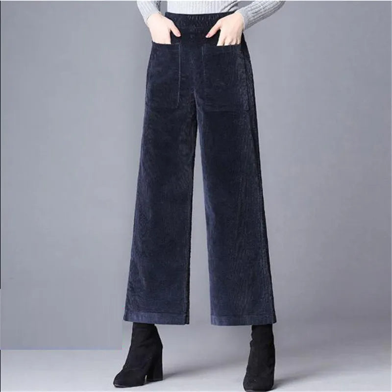 Black noir women's high-waisted flare trousers with a flattering retro fit, ideal for chic casual outfits.