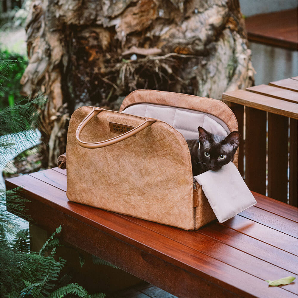 Side view of sustainable pet travel carrier, showing pockets and straps