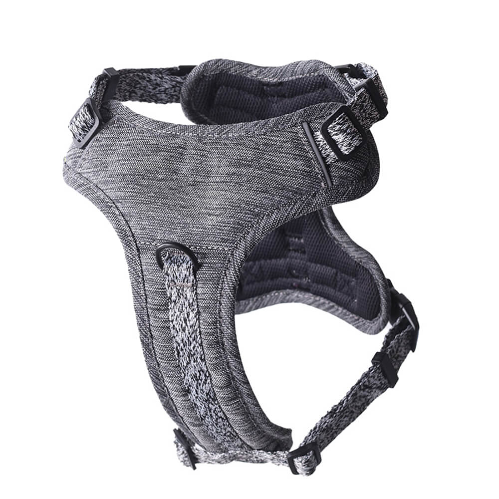 Close-up of the metal hardware and buckle on an eco-friendly recycled fabric no-pull dog harness.