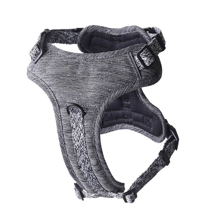 Close-up of the metal hardware and buckle on an eco-friendly recycled fabric no-pull dog harness.