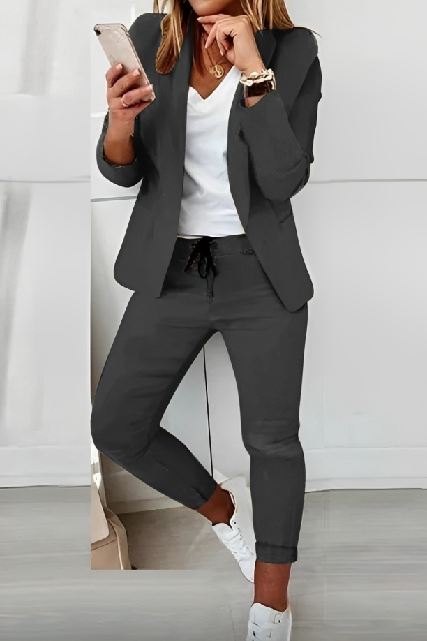 Effortless chic women's two-piece pant suit set with tailored blazer, perfect for work or casual elegance.