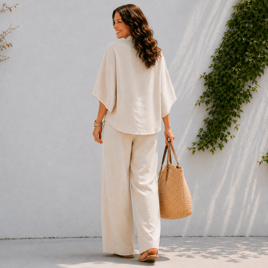 Women's two-piece oversized set featuring a stylish button-up blouse & comfortable wide-leg pants for spring.