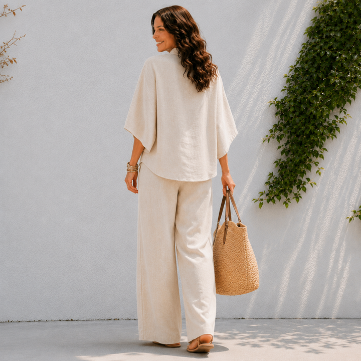 Women's two-piece oversized set featuring a stylish button-up blouse & comfortable wide-leg pants for spring.