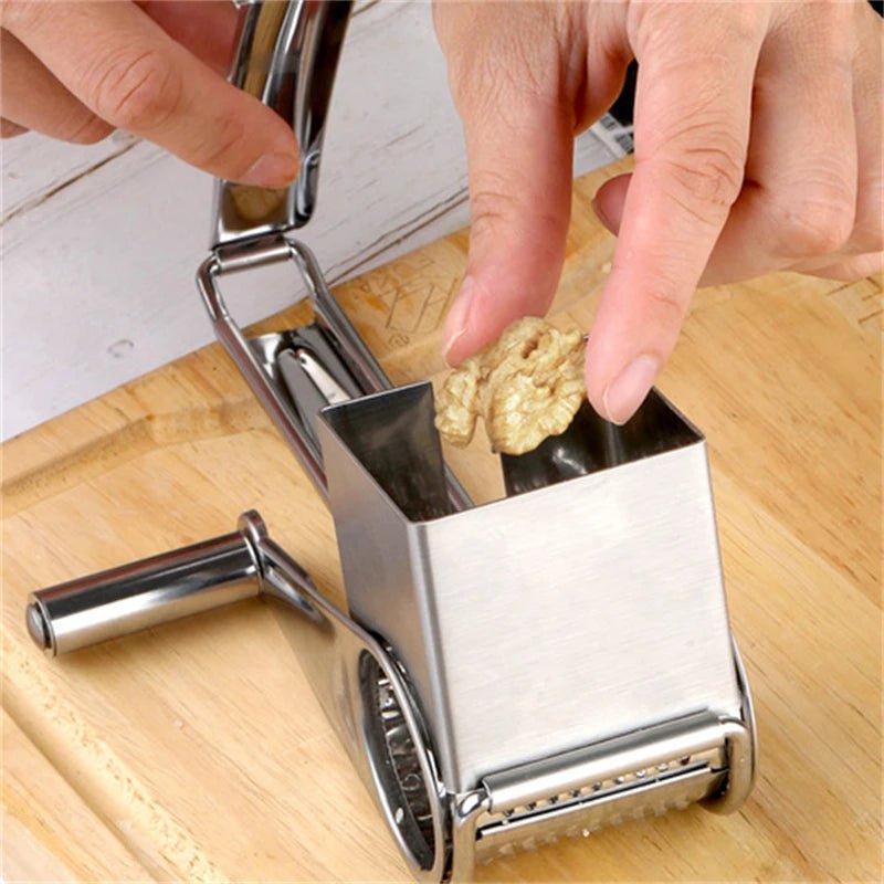 Easy-clean rotary grater, ideal for parmesan cheese, carrots, & other versatile kitchen prep tasks.