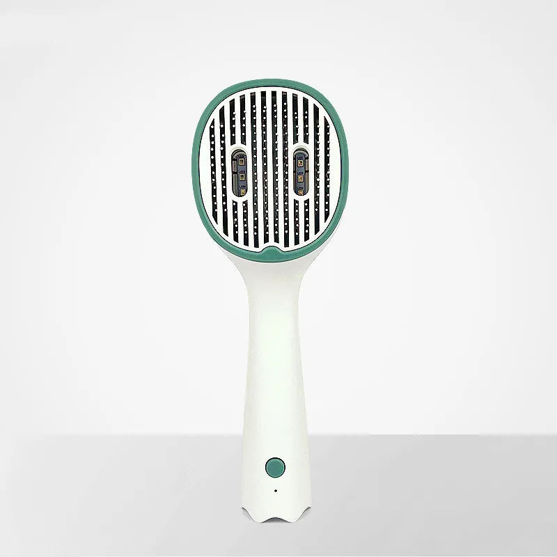 Close-up of the heating plates on an electric hair straightening detangling brush