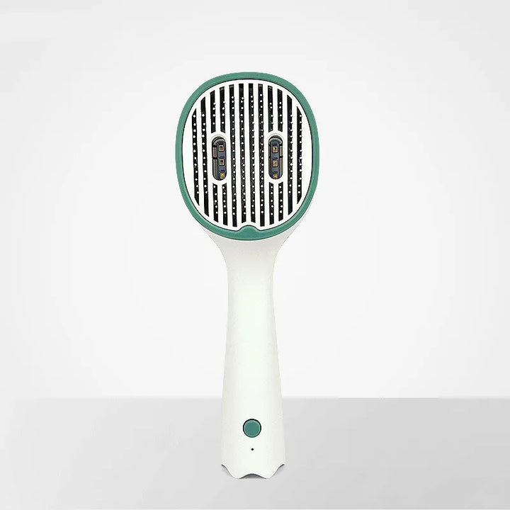 Close-up of the heating plates on an electric hair straightening detangling brush
