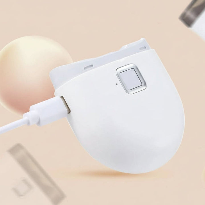 Ergonomic electric manicure tool with various attachments for complete, professional nail care & grooming.