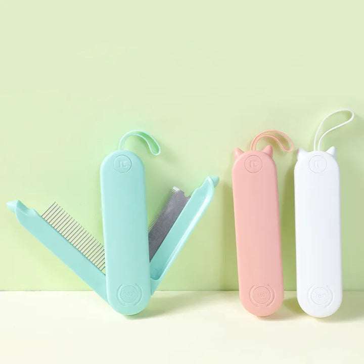 Electric pet grooming brush for cats and dogs, white and blue, with gentle detangling bristles.