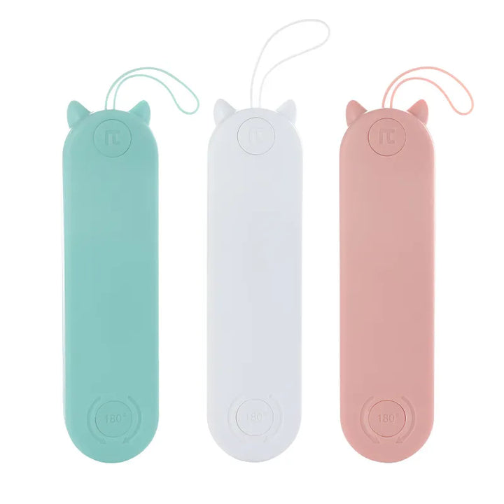 A white electric grooming brush for pets, with blue accents, ideal for cat and dog detangling.