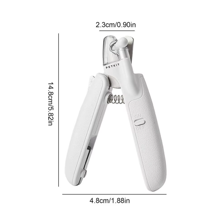 Owner gently using an electronic nail trimmer on a small dog's paw, demonstrating pet safe features.