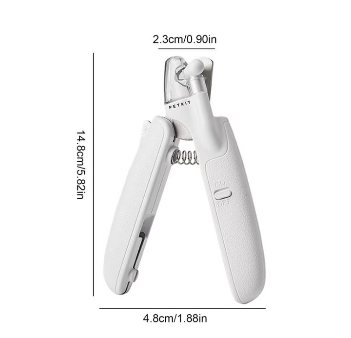 Owner gently using an electronic nail trimmer on a small dog's paw, demonstrating pet safe features.