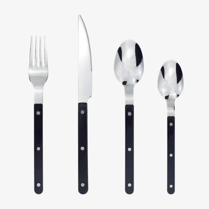 Elegant 24-piece engraved stainless steel cutlery set. Premium flatware for dining, perfect tableware for any meal.