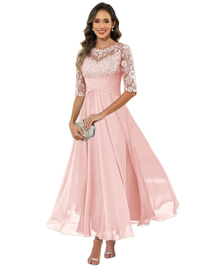 Woman modeling elegant A-line evening dress with 3/4 sleeves, perfect for galas & parties.
