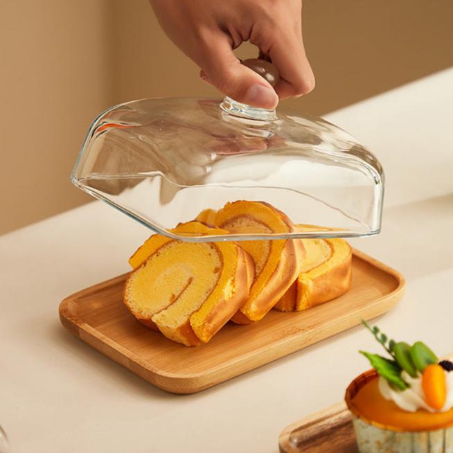 Elegant acacia wood butter dish with clear glass lid, perfect for kitchen counter & dining serveware.