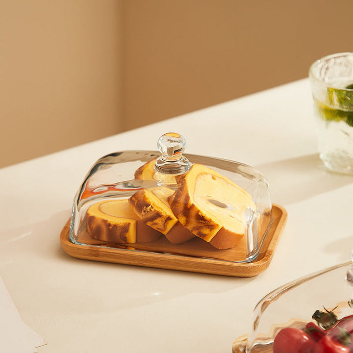 Countertop organizer: Elegant wood butter dish with glass lid, a stylish solution for kitchen butter storage.