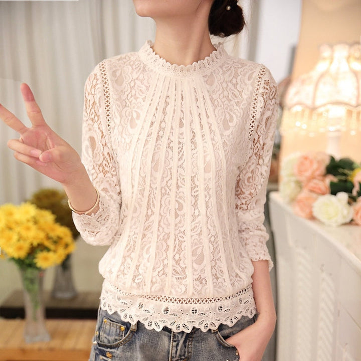 Chic women's long sleeve top, Amira, featuring intricate lace & floral details. A versatile & comfortable dressy blouse.