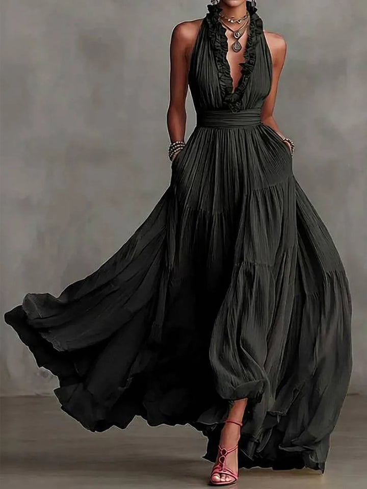 Sophisticated women's long evening gown, backless design, ruffle details, ideal for formal occasions.
