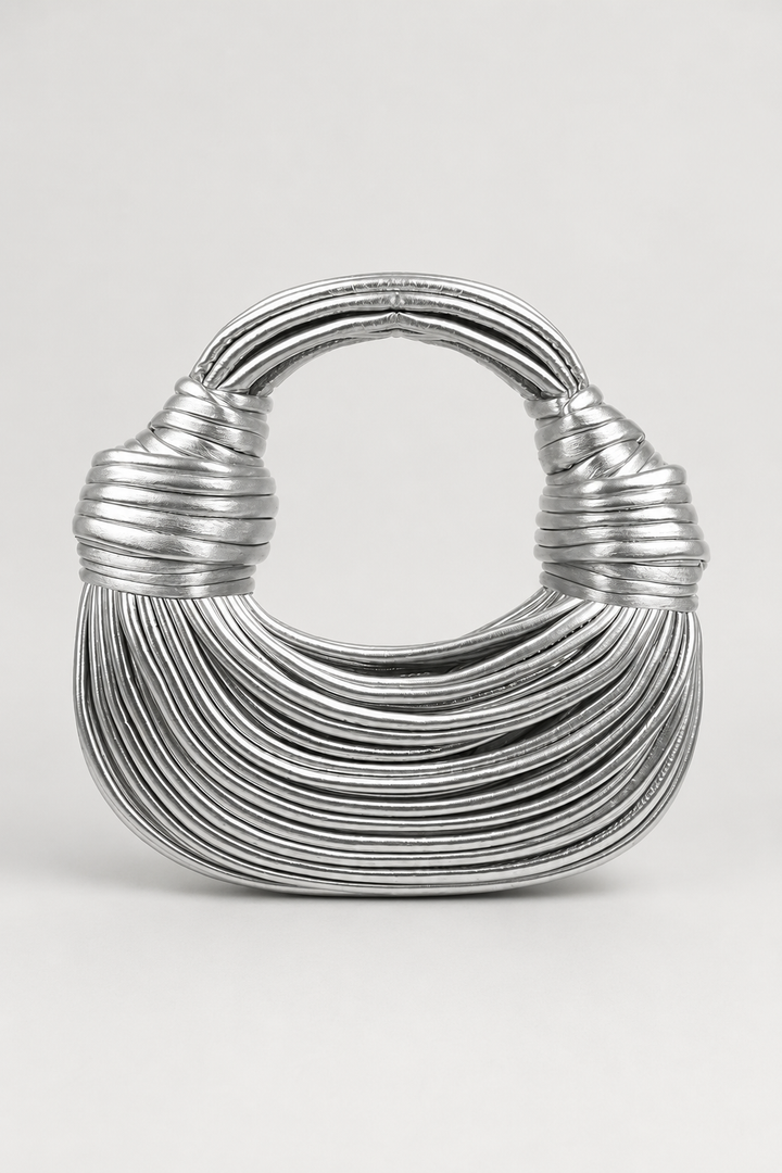 Black sculptural loop-handle crescent shoulder bag. Stylish women's modern everyday handbag, spacious & chic accessory.