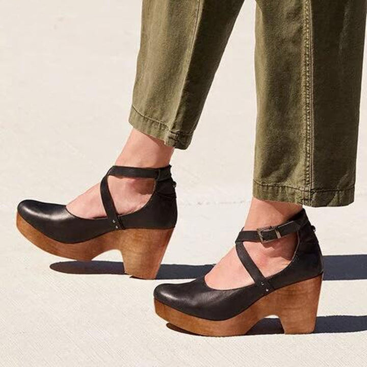 Elegant black closed-toe wedge heels for women, offering all-day comfort, perfect for office wear & everyday fashion.