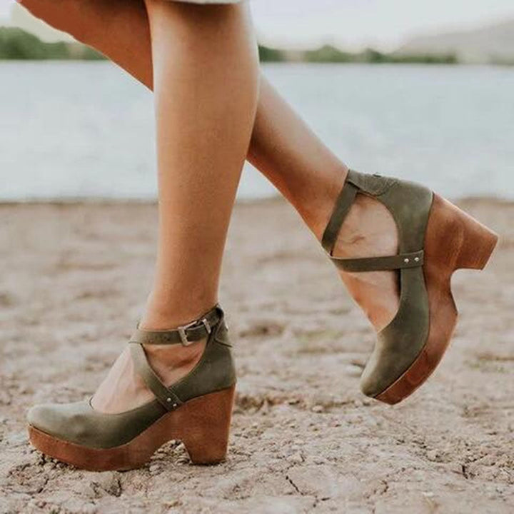 Fashionable green closed-toe wedge heels for women, providing comfort & an elegant design for everyday and office wear.