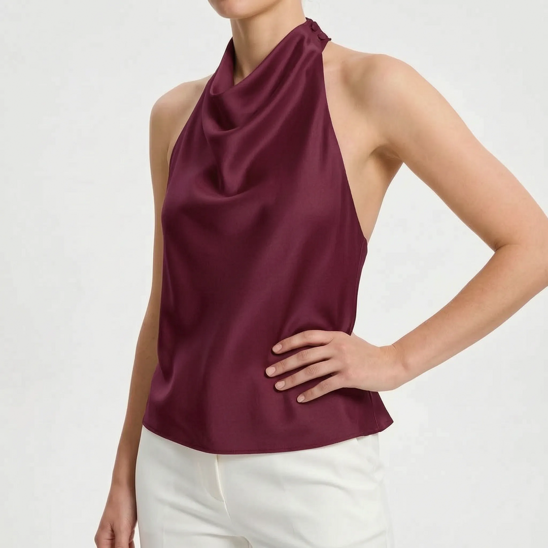 Chic sleeveless party top with a graceful draped halter neckline for women's evening wear.
