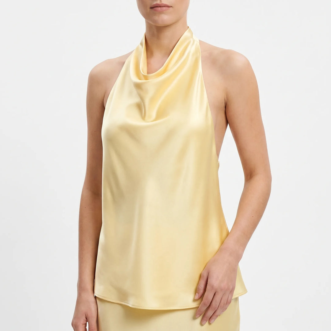 Chic women's sleeveless halter top with graceful draped neckline, ideal for summer.