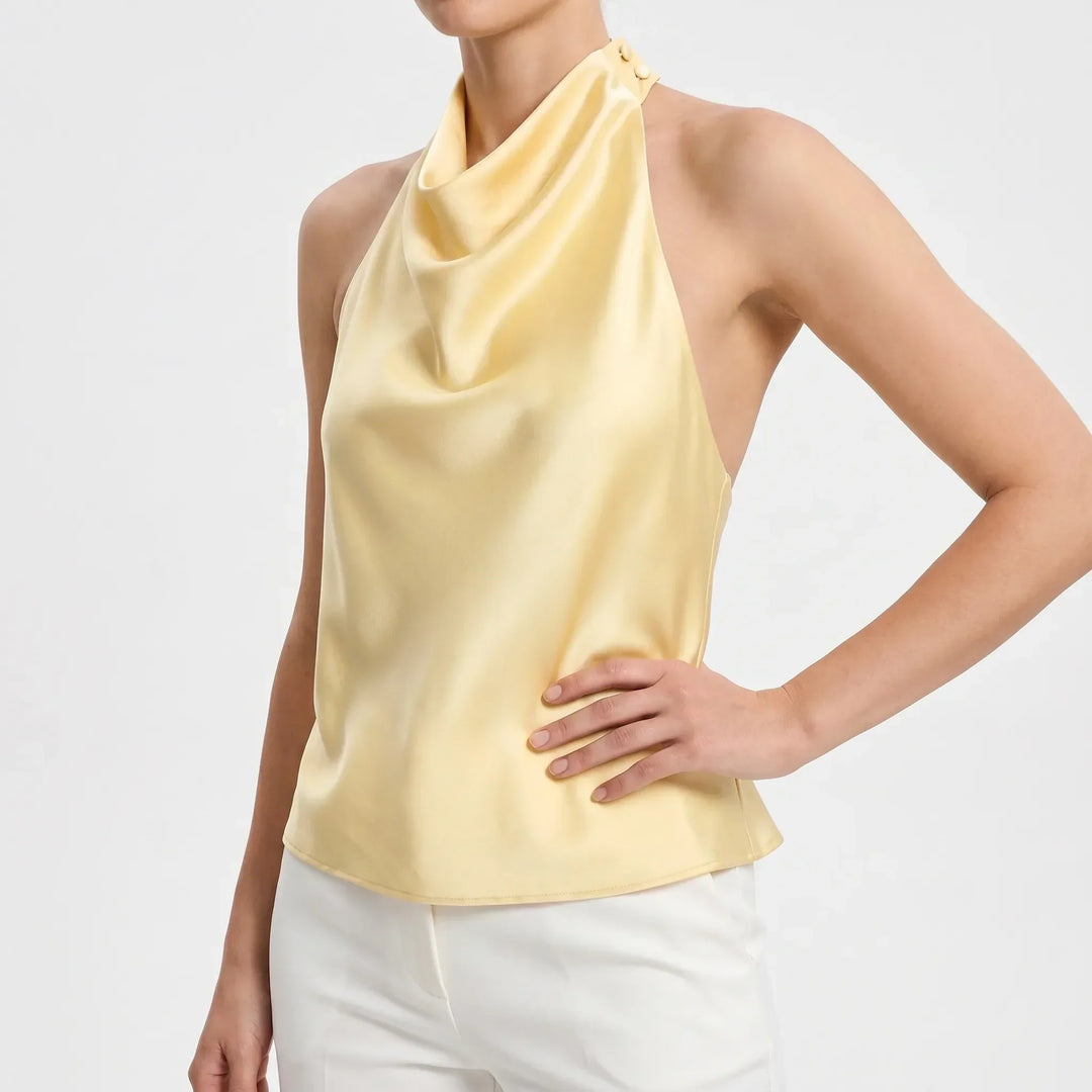 Sophisticated women's party top with elegant draped halter design, a chic choice.