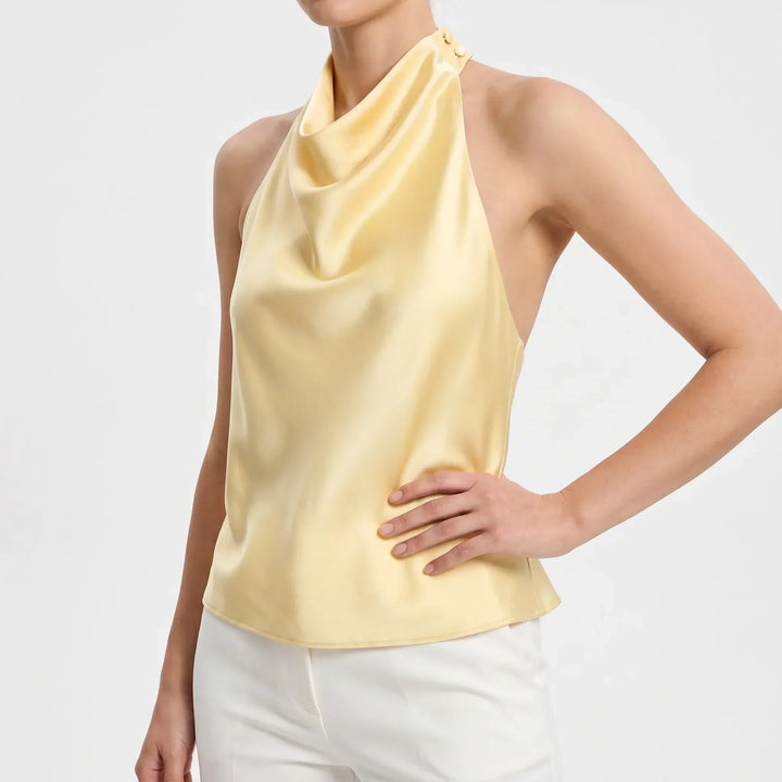 Sophisticated women's party top with elegant draped halter design, a chic choice.
