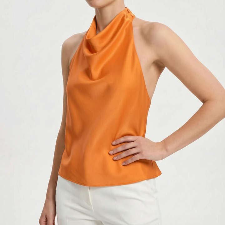 Women's elegant blue draped halter top, ideal for chic summer parties and evening wear.