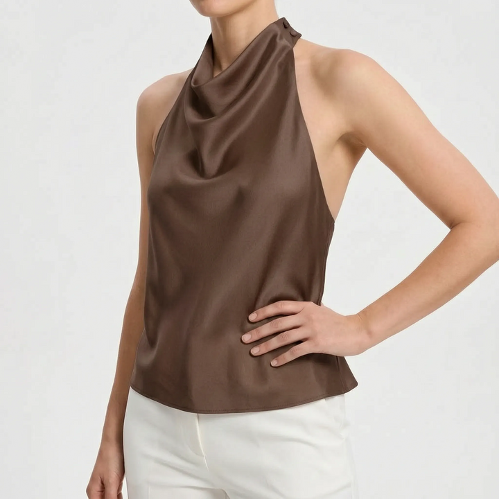 Elegant cream draped halter top, perfect for formal evening occasions and sophisticated looks.