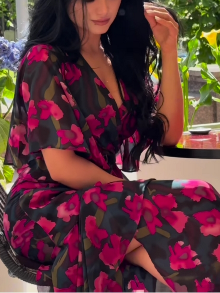 Flowy women's floral print maxi dress with V-neck & trumpet sleeves, perfect for summer parties or casual chic.