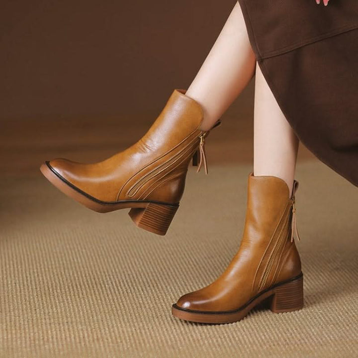 Close-up of chic women's high-heel ankle boots, highlighting the elegant design and comfortable fit.