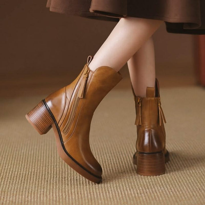 Sophisticated women's black ankle boots with high heels, perfect for stylish comfort & everyday wear.