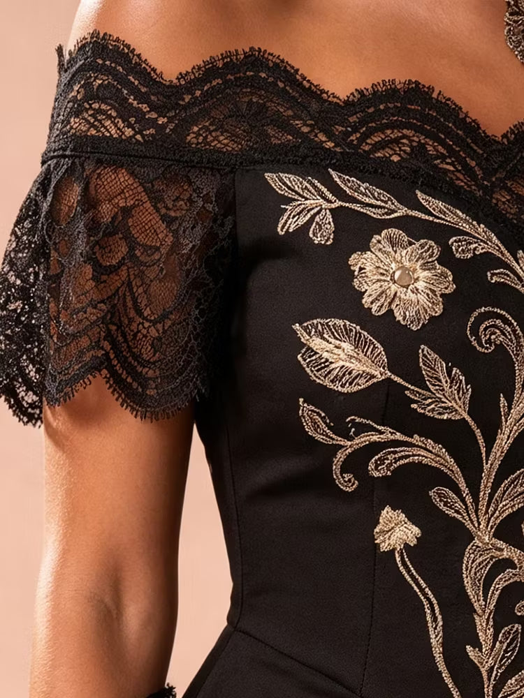 Semi-formal black evening wear: stunning gold embroidered lace midi dress with an elegant asymmetrical hem.